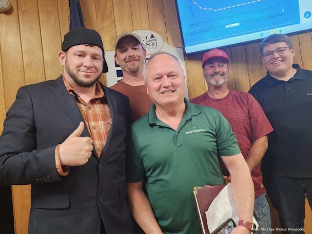 Right To Life of East Texas Director Mark Lee Dickson takes a picture with Pastor David Osborne and members of Grayson County Community after the ordinance is moved forward for publication. (Photo via Facebook)