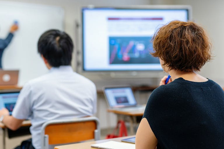 Mid adult woman in a continuing education class at a community college or university