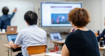 Mid adult woman in a continuing education class at a community college or university