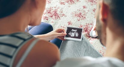 couple looks at ultrasound