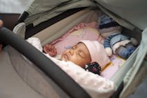 Cute sleeping baby in pram