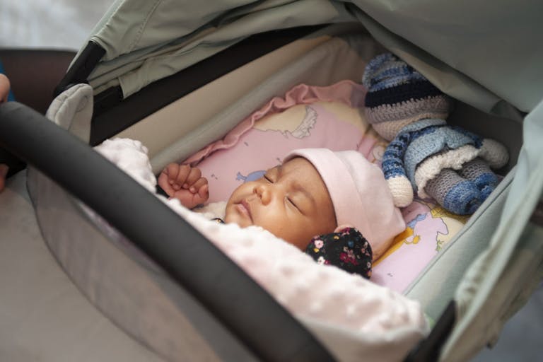 Cute sleeping baby in pram