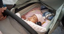 Cute sleeping baby in pram
