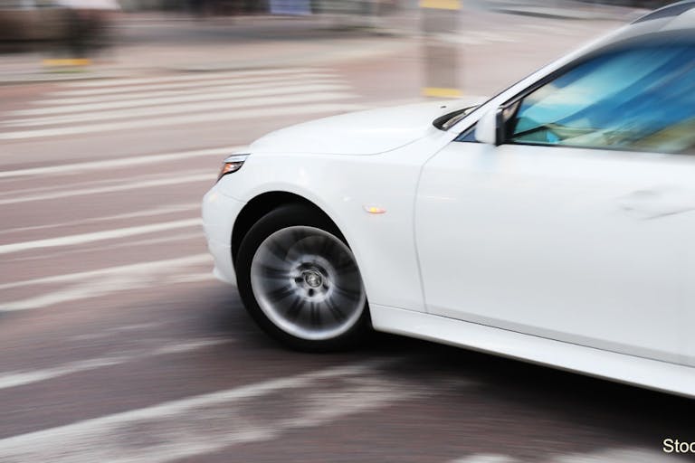 Left turning car on zebra crossing