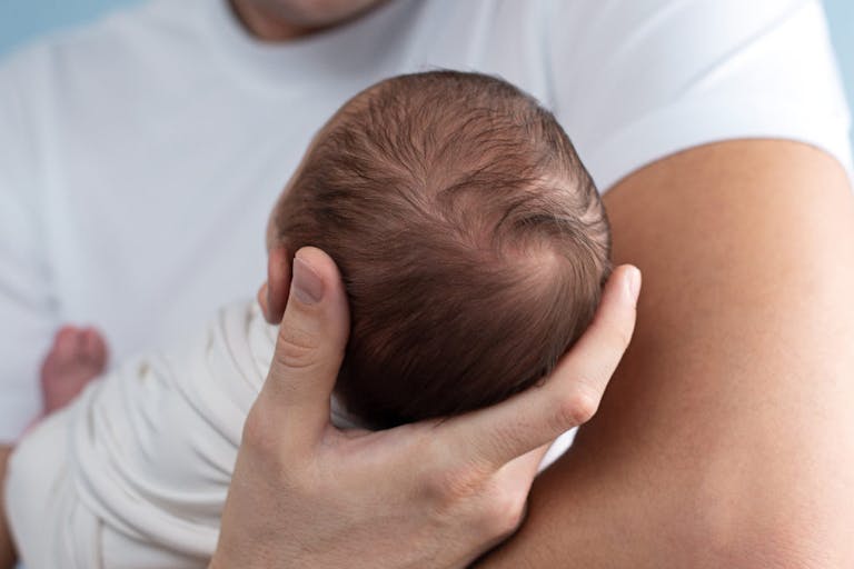 Father Is Holding A Newborn Baby In His Arms. Paternity.