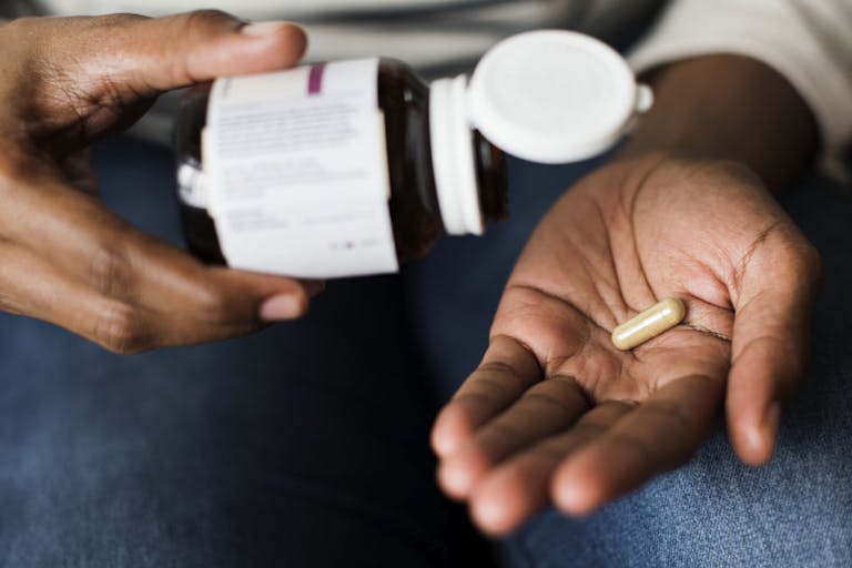 Woman taking pills for her health