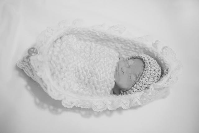 Bridget shortly after her birth in the cradle knitted by her grandmother. ⒸAshley Opliger stillborn, Bridget's Cradles