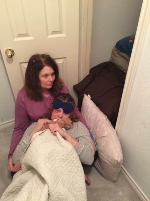 Jeanneane Maxon is held by her mother Jenny following a tornado warning days after her brain surgery. Photo courtesy of Jeanneane Maxon. Do not reprint.