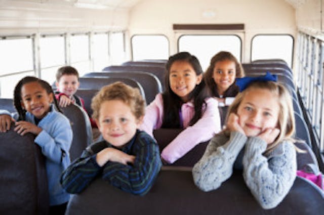 Children sitting inside school bus