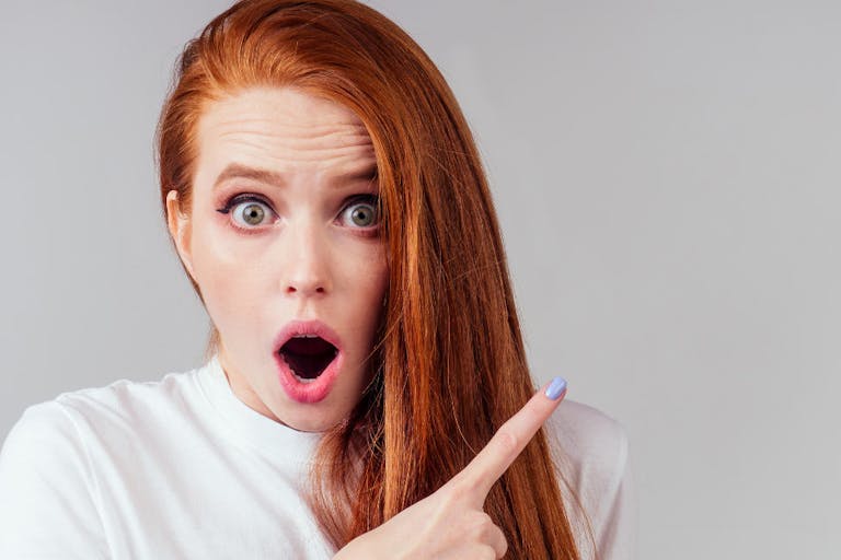 annoying redhaired ginger woman feeling irritation and anger studio background