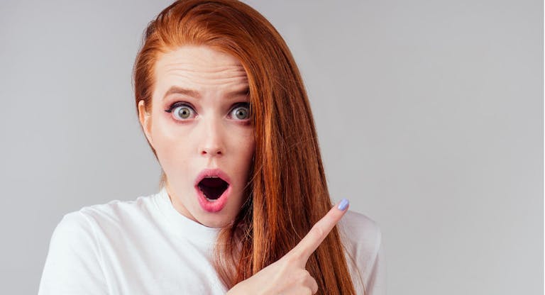 annoying redhaired ginger woman feeling irritation and anger studio background
