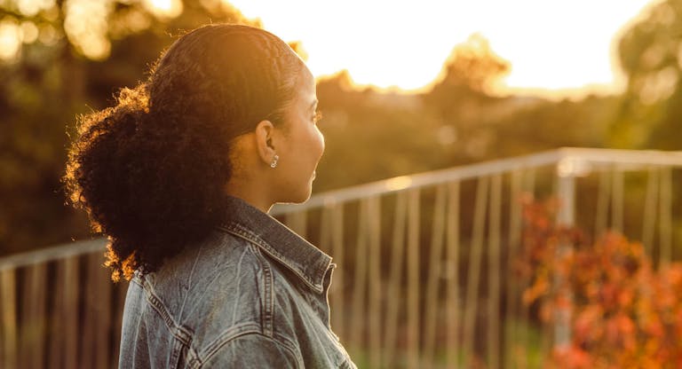 Young woman looking at the view and relaxing
