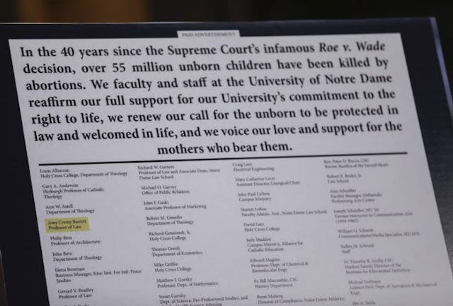 WASHINGTON, DC – OCTOBER 13: A reproduction of a political ad highlighting the name of U.S. Supreme Court nominee Judge Amy Coney Barrett is displayed during the Senate Judiciary Committee on the second day of her Supreme Court confirmation hearing on Capitol Hill on October 13, 2020 in Washington, DC. With less than a month until the presidential election, President Donald Trump tapped Amy Coney Barrett to be his third Supreme Court nominee in just four years. If confirmed, Barrett would replace the late Associate Justice Ruth Bader Ginsburg. (Photo by Leah Millis-Pool/Getty Images) Judge Amy Coney Barrett grilled on Roe v. Wade during second day of Senate hearings image