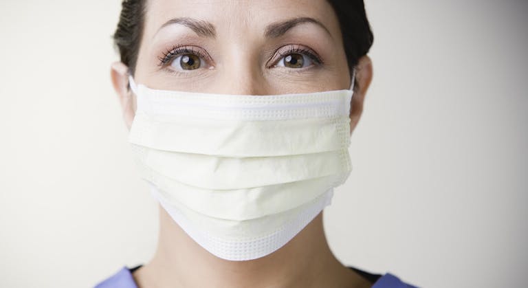Close up of female doctor wearing surgical mask