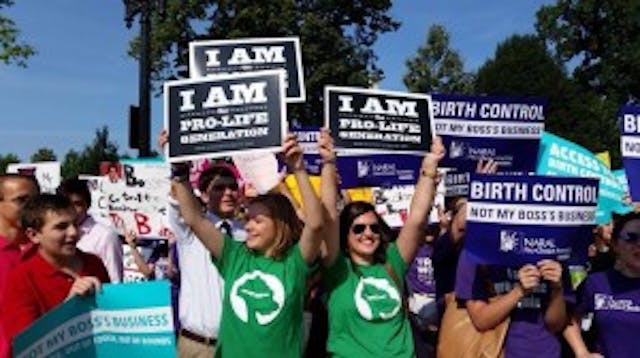 Claire with a group of students outside of the Supreme Court in Washington, D.C. when the Hobby Lobby religious freedom case was decided. 10511208_10203986487960358_7729496734993753306_n