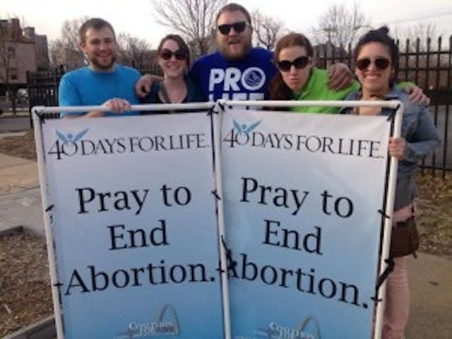 Joshua Schmidt, Maura Weis, Brad Baumgarten, Katy Guill, and Faith Mary promote life.