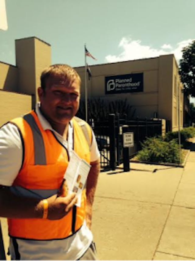 Brad giving hope to hurting women right outside Planned Parenthood in St. Louis, MO. Brad offering hope to hurting women right outside Planned Parenthood in St. Louis, MO.