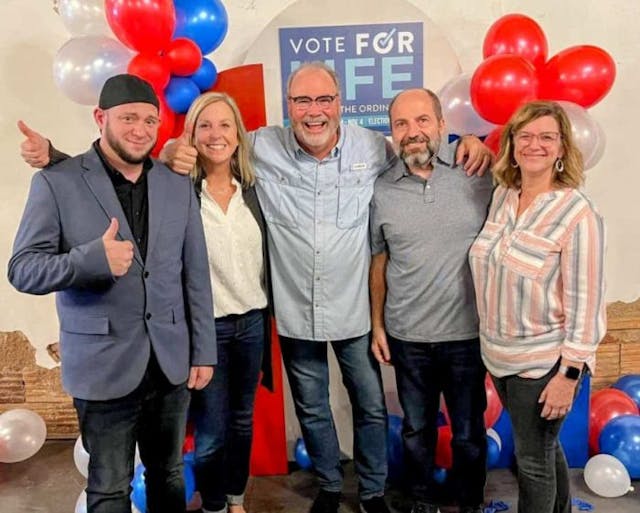 Right To Life of East Texas Director Mark Lee Dickson takes a picture with Pastors Scott Beard and Chuck Farina, along with their wives, who led the Abilene Initiative. (Photo courtesy of Mark Lee Dickson)
