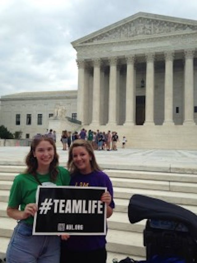 Deanna, outside Supreme Court before Hobby Lobby with her friend, Erin Stoyell-Mulholl. scotus2