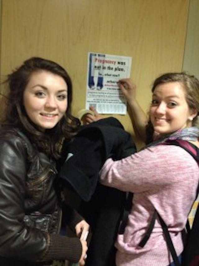 Katie and her sister, Gemma, flyering on campus. 1394465_706019476094801_596486912_n