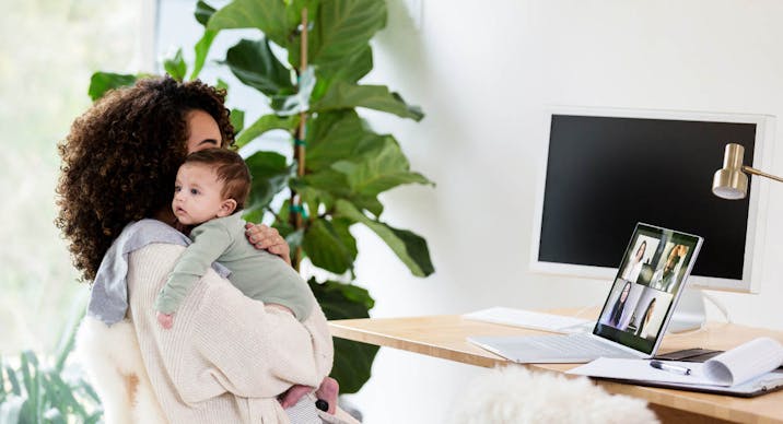 Mother talks with colleagues virtually while caring for her son