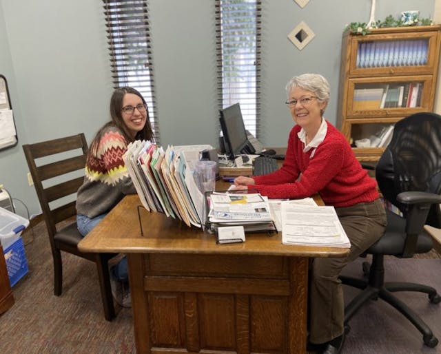 Robinson with a Resource Center intern/Gail Holmes Robinson with a Resource Center intern/Gail Holmes