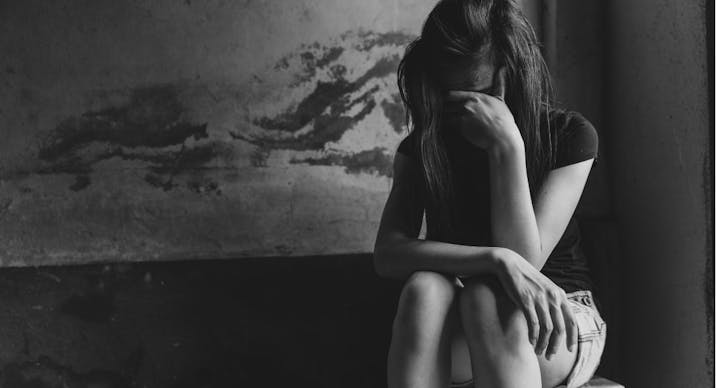 Young depressed woman, domestic and rape violence,beaten and raped sitting in the corner, Domestic violence. Copy space.