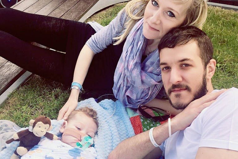 Connie Yates and Chris Gard enjoy a picnic with their son Charlie Gard who was on life support.