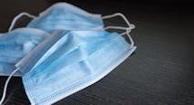 Respiratory mask on desk in office, Protective medical mask with 2019-nCoV, Coronavirus protection concept.