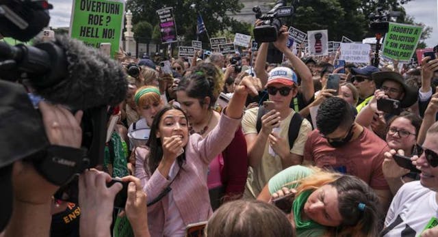 WASHINGTON, DC – JUNE 24: Rep. Alexandria Ocasio-Cortez (D-NY) speaks to abortion-rights activists in front of the U.S. Supreme Court after the Court announced a ruling in the Dobbs v Jackson Women’s Health Organization case on June 24, 2022… (Photo by Nathan Howard/Getty Images) ‘This is not over’: Biden, Pelosi, AOC, and others respond to Roe’s fall image