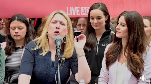 Lauren Muzyka speaks at the Rally Against Bullying outside Planned Parenthood in Philadelphia alongside Lila Rose in May 2019.