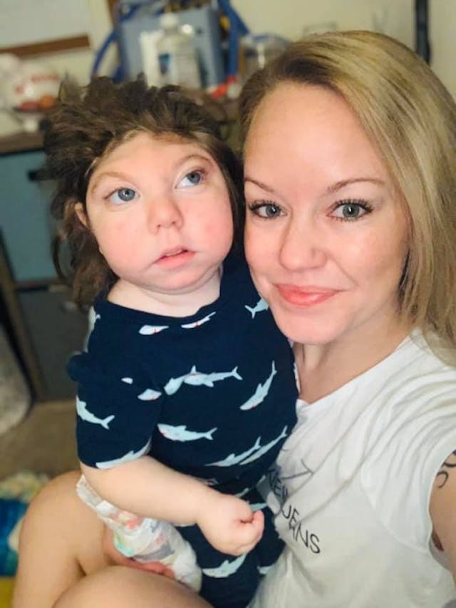 Jaxon Buell and his mom. Photo via Facebook. Doctors told all of these parents to abort their babies — and all of them beat the odds image