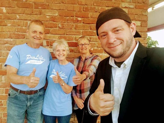 Right To Life of East Texas Director Mark Lee Dickson and area supporters of the Leon County Initiative take a picture after the historic vote. (Mark Lee Dickson)