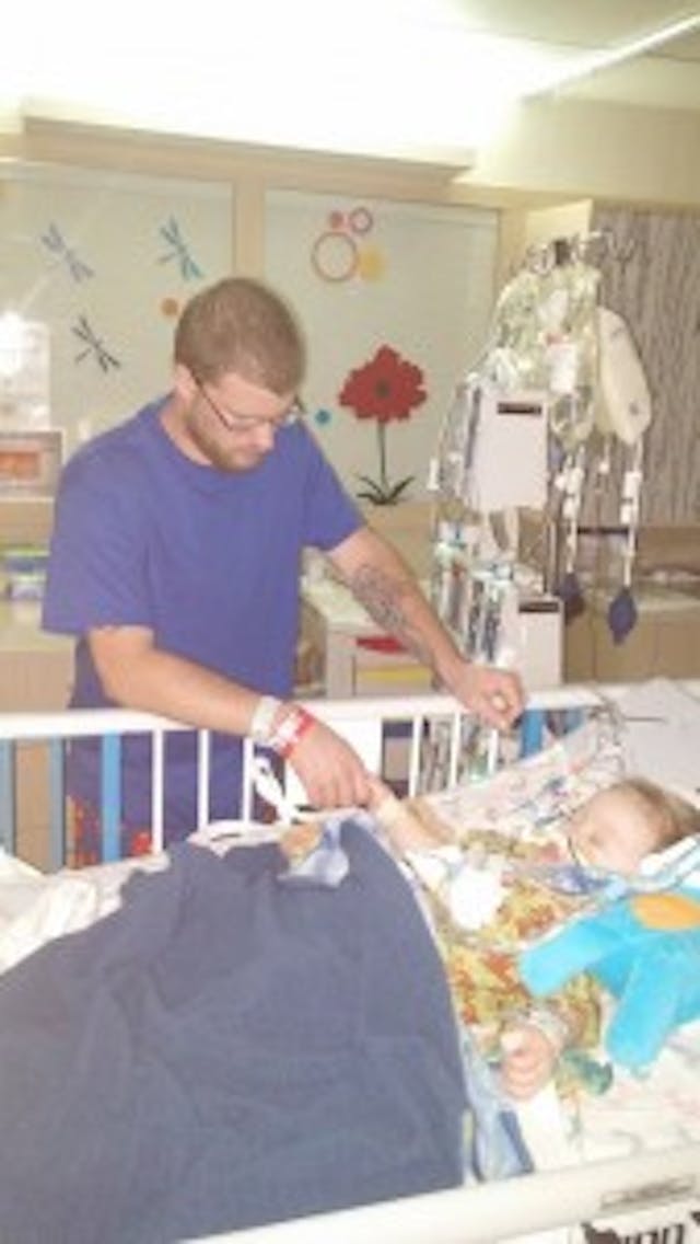Easton and his father after their surgeries. Easton and his father after their surgeries.