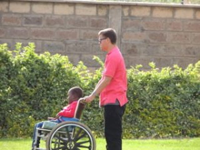 Simon and a boy at the ministry. Photo courtesy of Tracey Hagman. premature