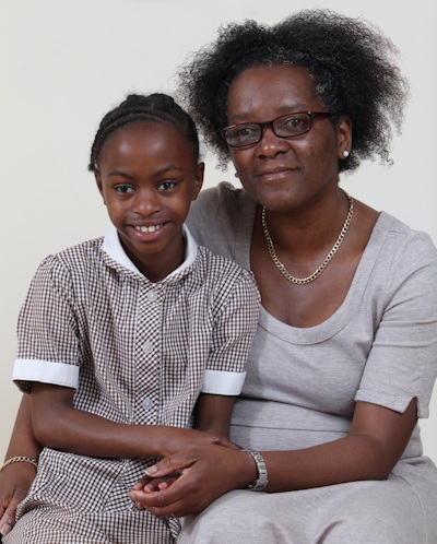 Aaliyah at age 10, with her mom.