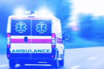 An ambulance driving on a road