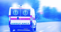 An ambulance driving on a road