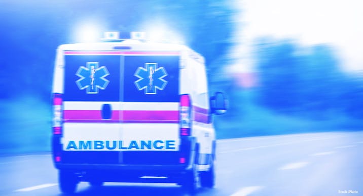An ambulance driving on a road