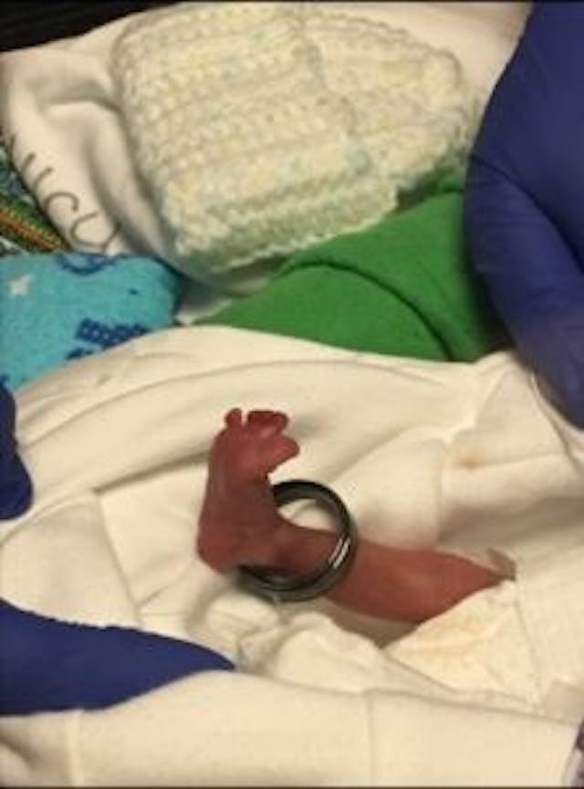 Rayden with his father’s wedding band. Photo via YouCaring. Photo from You Caring