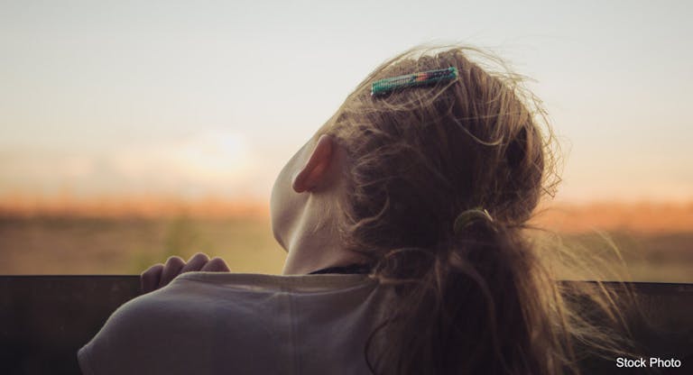 Girl looking out of car window