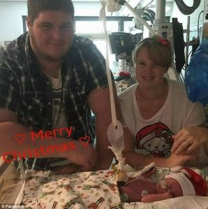 Teddy and his parents. Photo via Facebook.