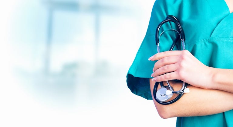 Female Doctor holding a stetoschope in her hands