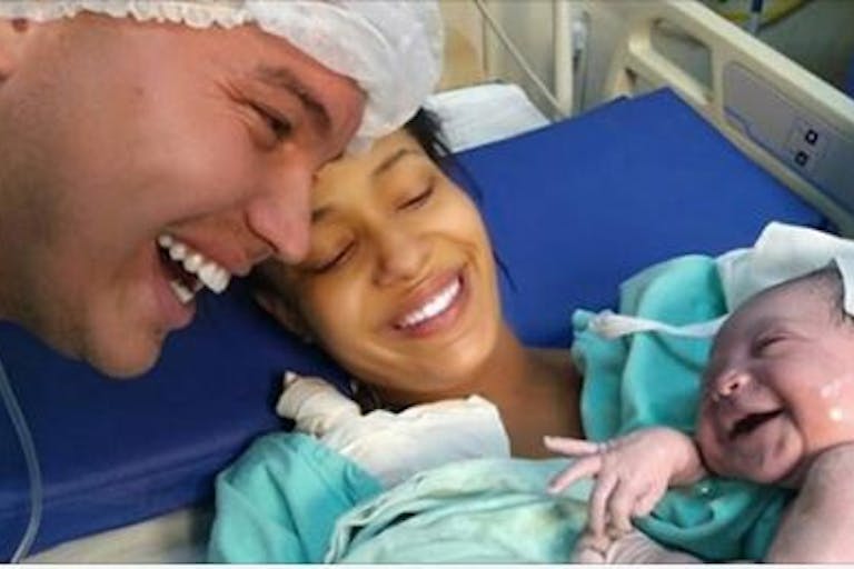 newborn smiles at dad