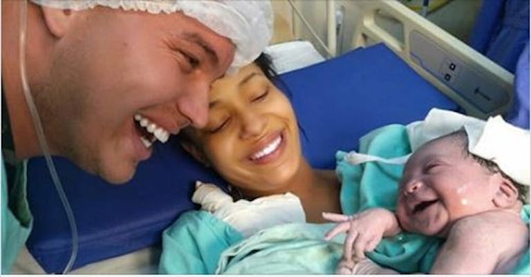 newborn smiles at dad