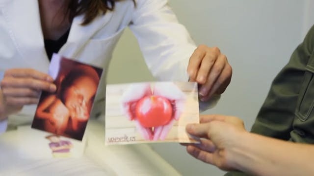 Screenshot from the video. The abortionist tells them that each photo is of a preborn child at 15 weeks.