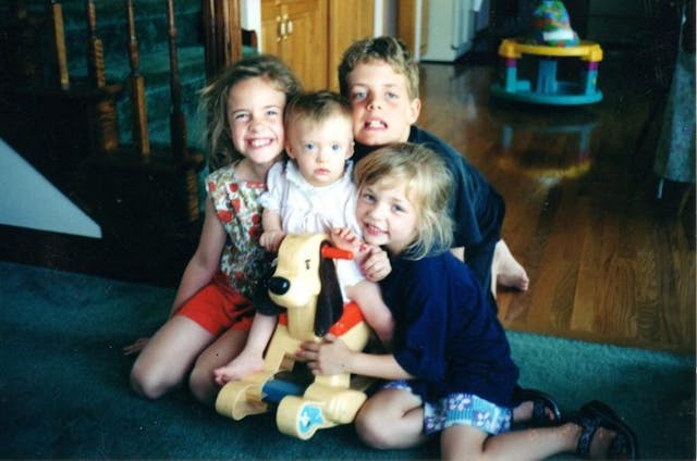 Belinda (age 2) and her siblings Nathanael, Ashleigh, and Felicity, when they were young Down syndrome