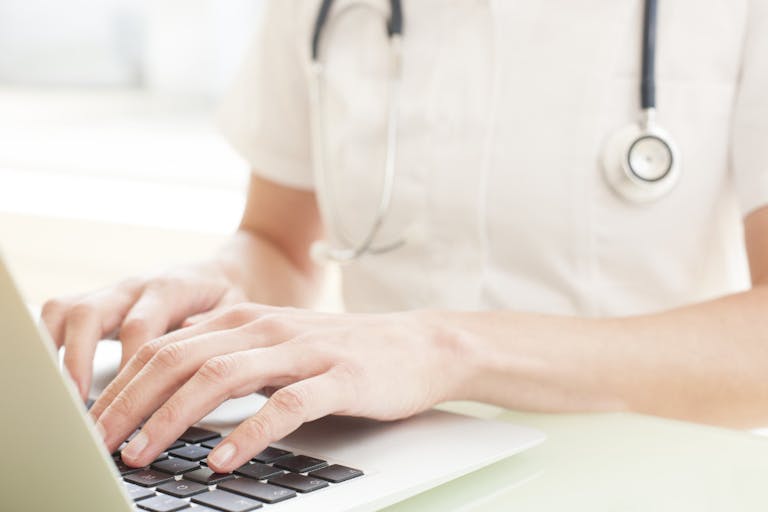 Nurse using a laptop computer.