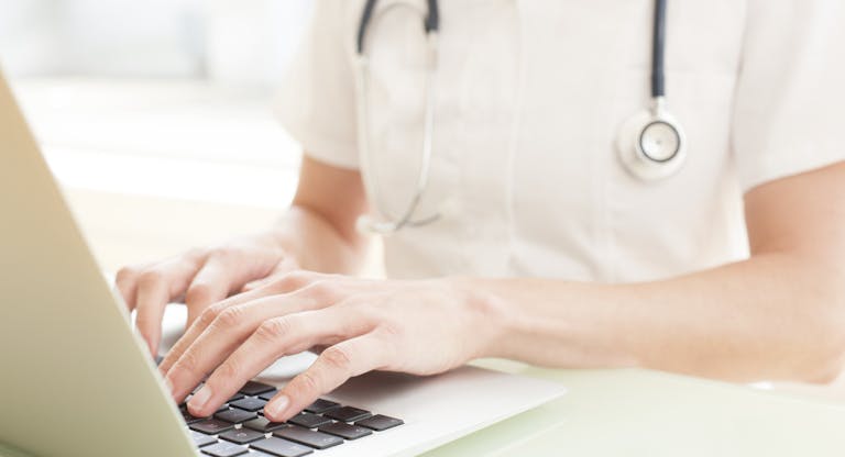 Nurse using a laptop computer.