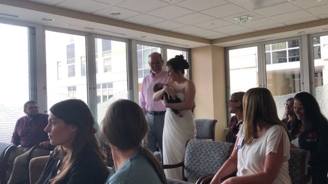 Acevedo carries Oliver down the aisle. Courtesy: Facebook. Preemie acts as mom’s bridal bouquet during wedding in hospital chapel image